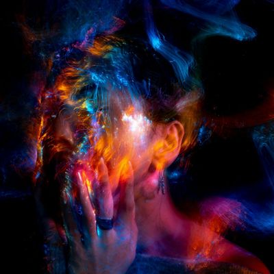 Abstract silhouette of a human body with glowing energy lines.